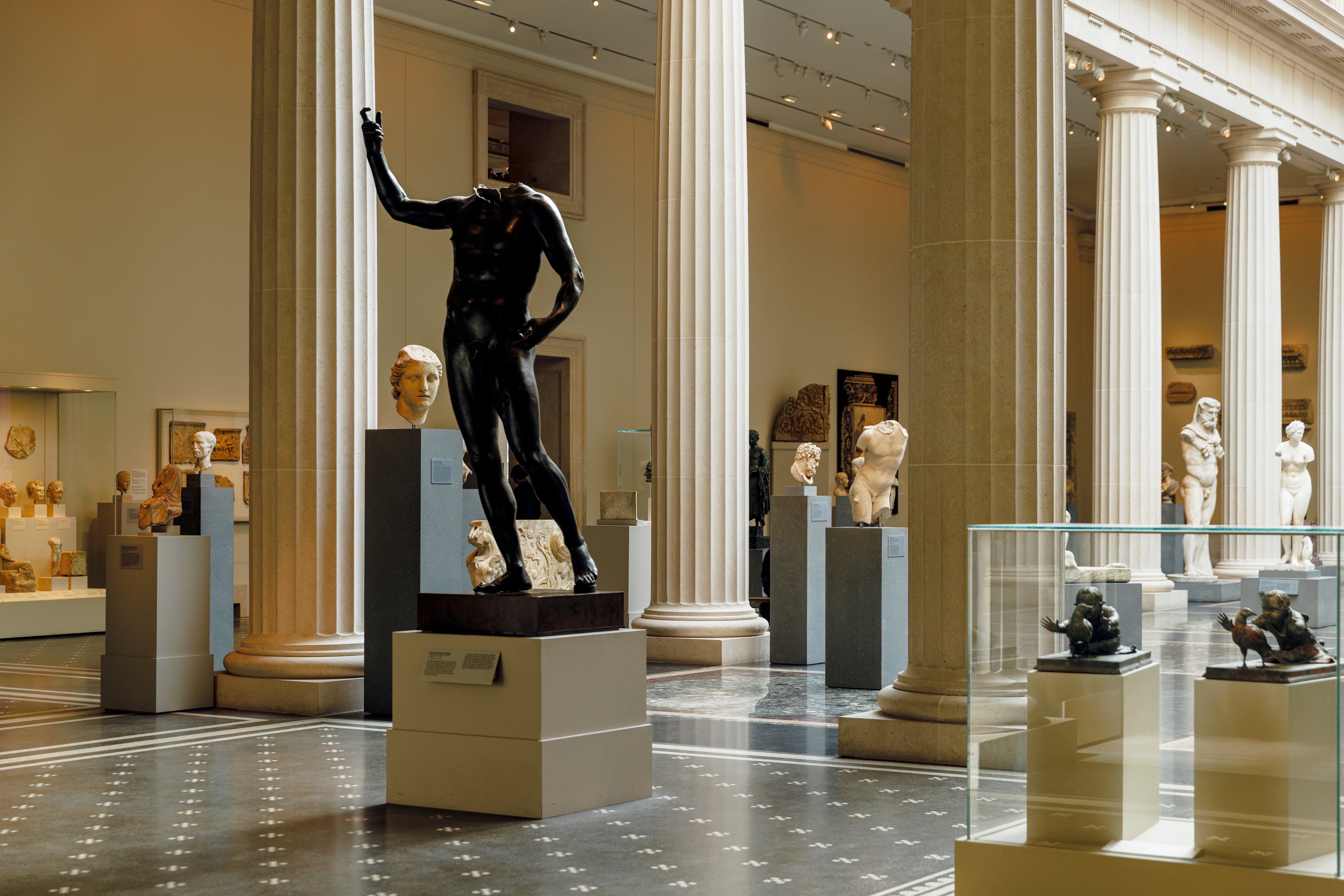 Image of a gallery filled with sculptures at The Met